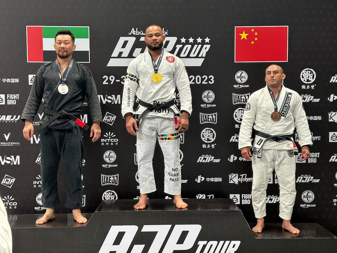 ZHAN and BLITZFIGHT BJJ gis worn by athletes on the podium at an AJP Tour competition