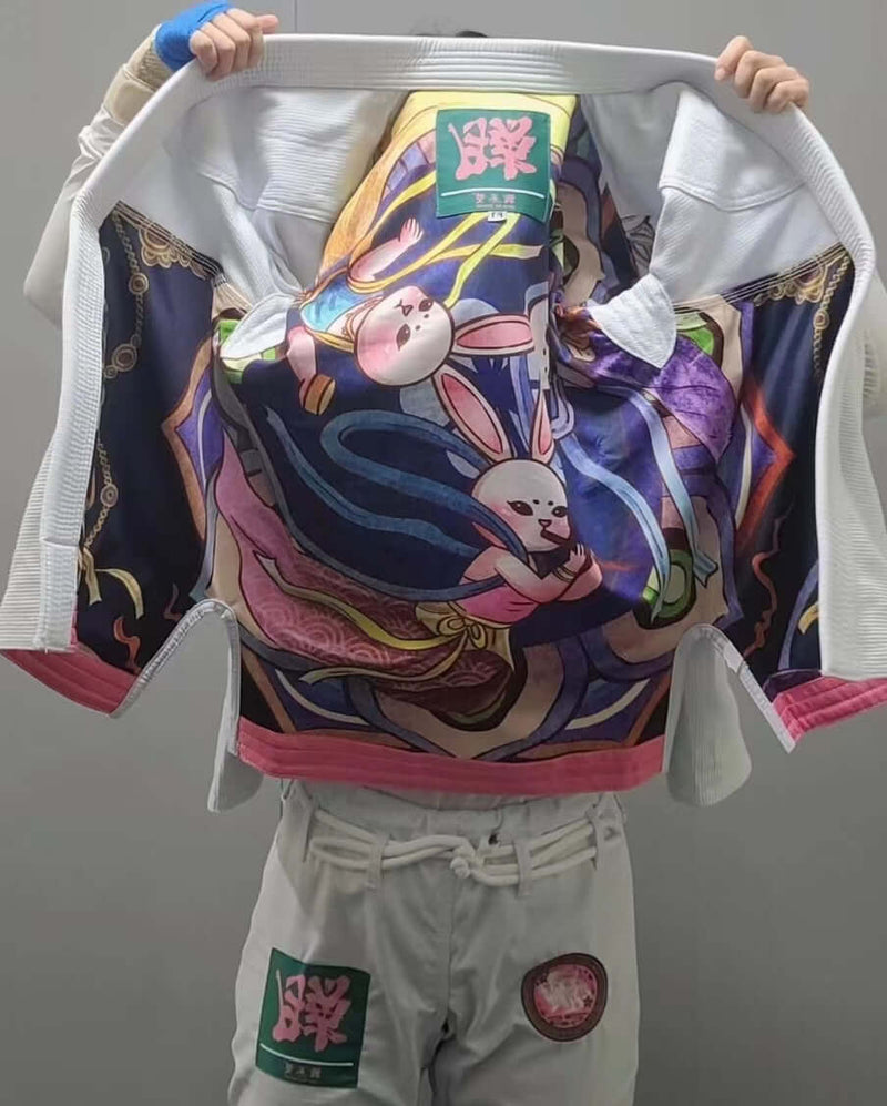 Zodiac BJJ Gi Collection showcasing intricate rabbit design on the back, highlighting unique artwork and style.