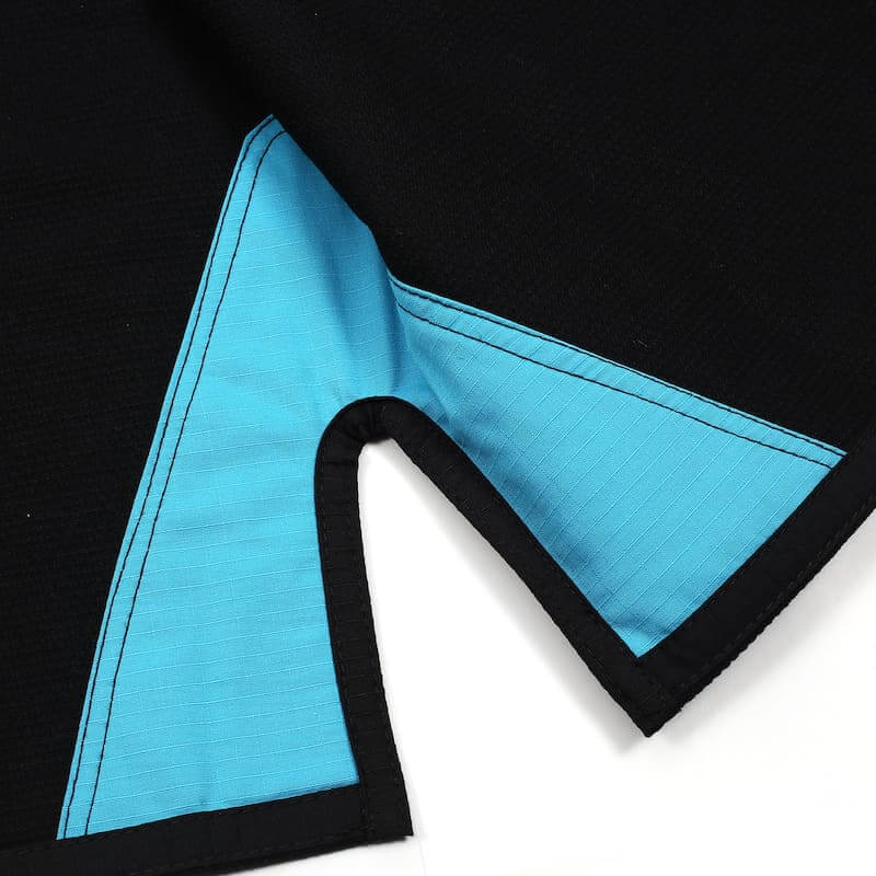 Detail of the ZHAN Basic Women's BJJ Gi: Embrace Elegance & Performance in black and blue fabric.
