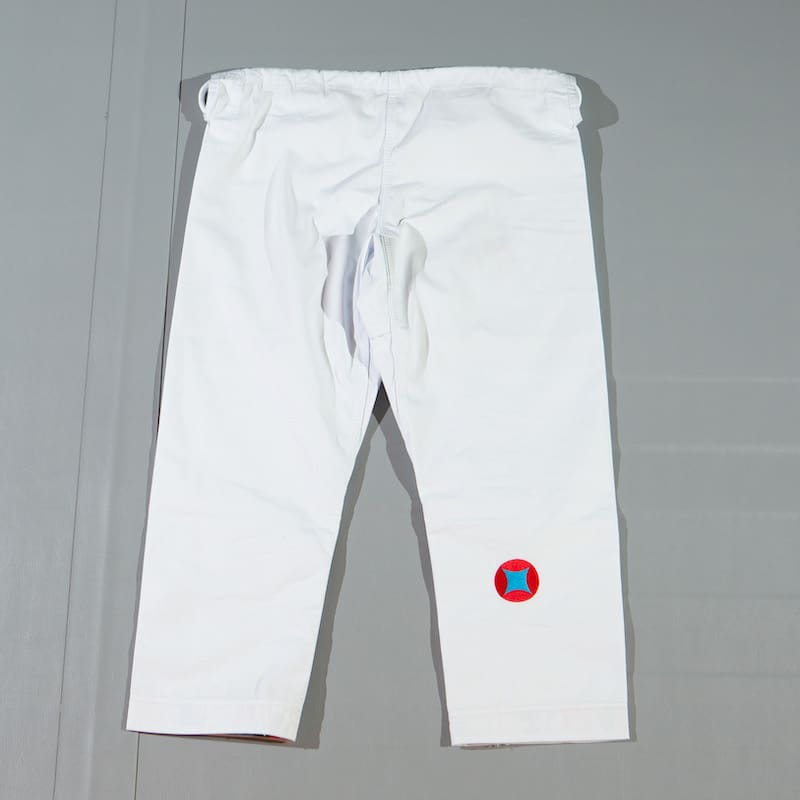 ZHAN Year of the Rabbit BJJ Gi: Embrace the Zodiac Spirit - White pants with logo detail.