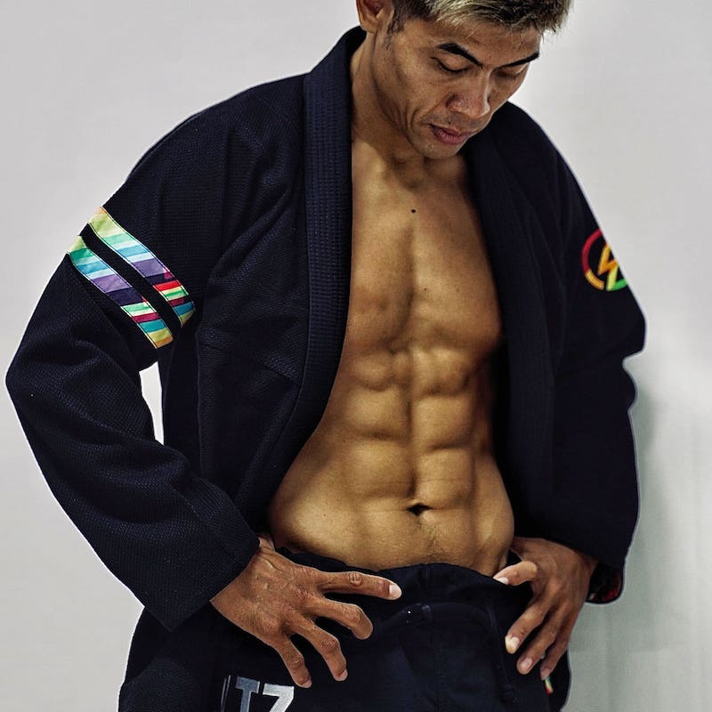 BLITZ DEFENSE Series Rainbow BJJ Set: Durable & Stylish Gi worn by a model showcasing its vibrant design and fit.