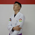 BLITZ DEFENSE Series Rainbow BJJ Set: Durable & Stylish Gi worn by a model showcasing vibrant design and quality craftsmanship.