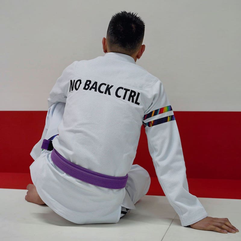 BLITZ DEFENSE Series Rainbow BJJ Set: Durable & Stylish Gi worn by a practitioner showing the back design.