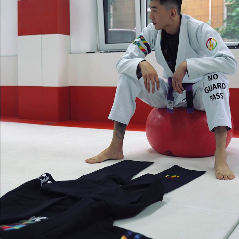 BLITZ DEFENSE Series Rainbow BJJ Set: Durable & Stylish Gi showcased in a training environment.