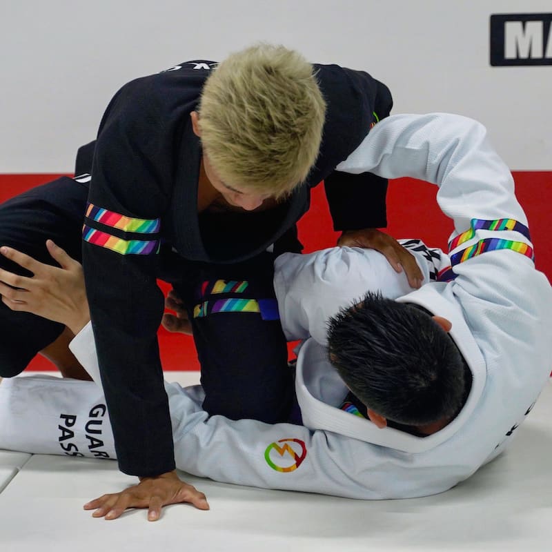BLITZ DEFENSE Series Rainbow BJJ Set: Durable & Stylish Gi in action during a Brazilian Jiu-Jitsu match.