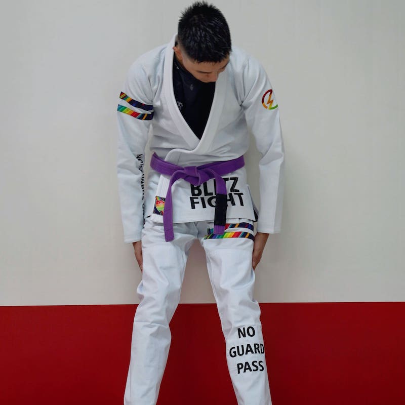BLITZ DEFENSE Series Rainbow BJJ Set: Durable & Stylish Gi worn during training, showcasing vibrant design and durability.