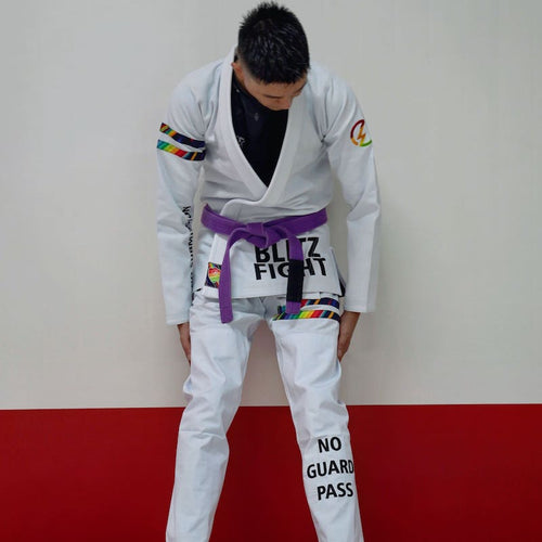 BLITZ DEFENSE Series Rainbow BJJ Set: Durable & Stylish Gi worn during training, showcasing vibrant design and durability.