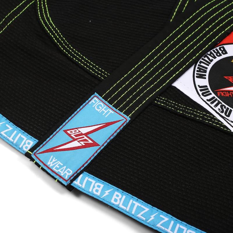 BLITZ Kids Classic BJJ Gi: Tradition & Excellence, close-up of gi label and stitching details.