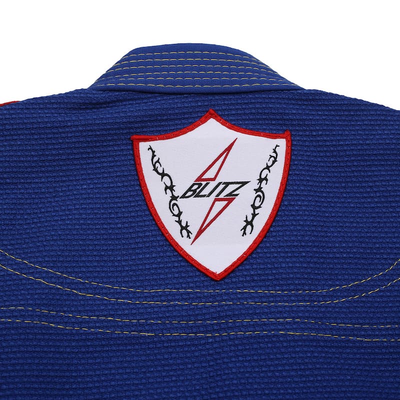 BLITZ Kids Classic BJJ Gi: Tradition & Excellence logo detail on blue jacket collar