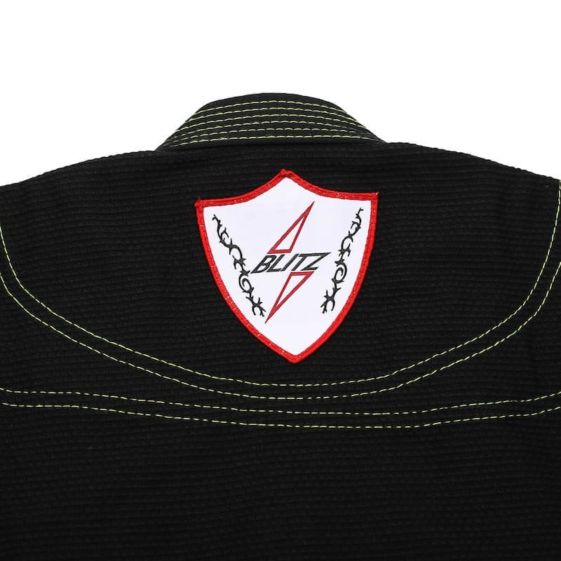 BLITZ Kids Classic BJJ Gi: Tradition & Excellence logo on the back of the black gi collar.