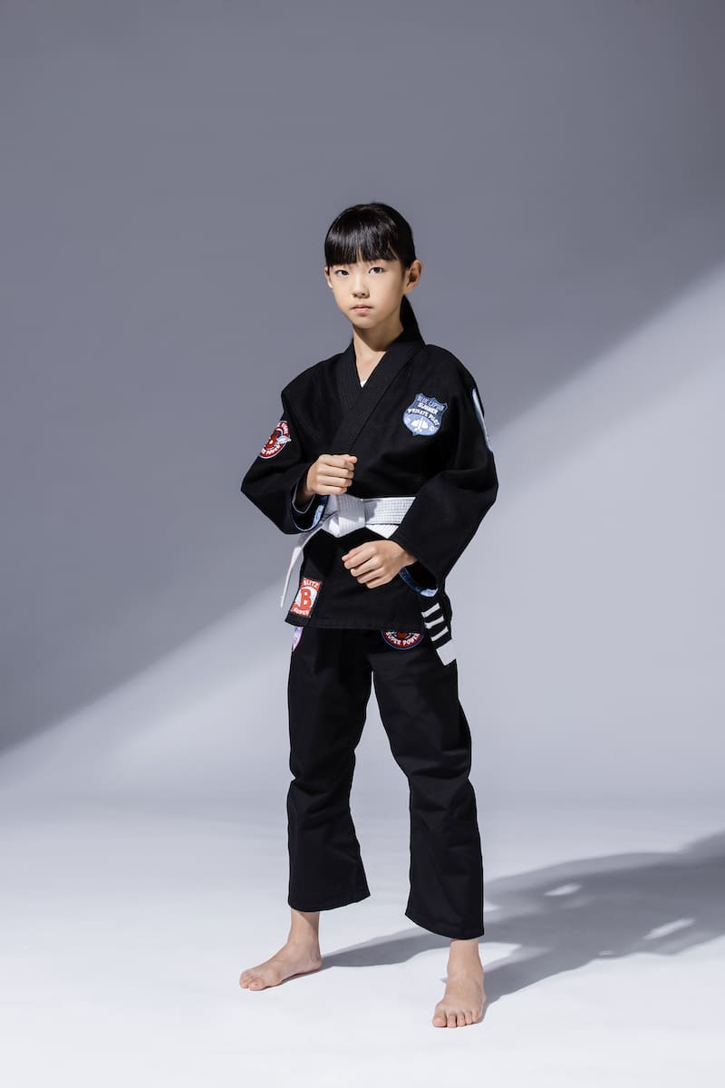 BLITZ Kids Super Power BJJ Gi on a young student ready for training in Brazilian Jiu-Jitsu.