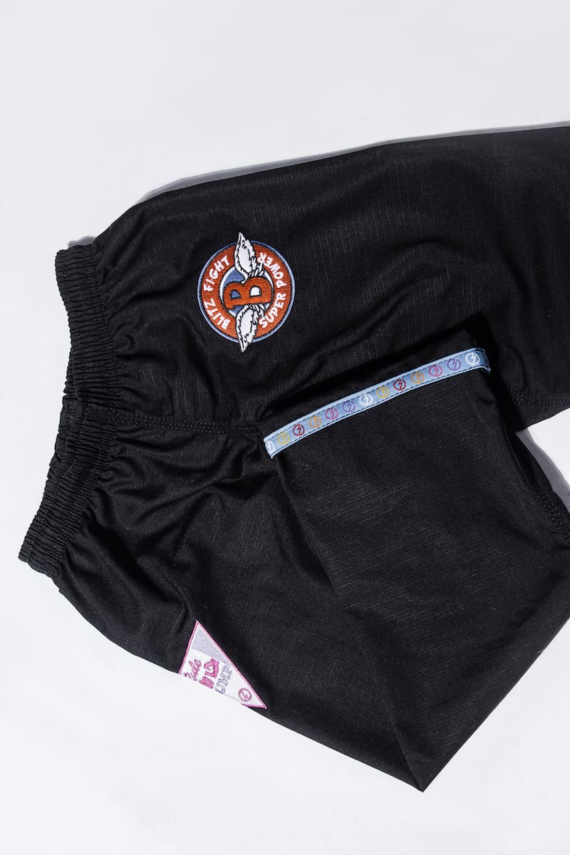 BLITZ Kids Super Power BJJ Gi black pants with logo and colorful waistband, designed for young martial artists.