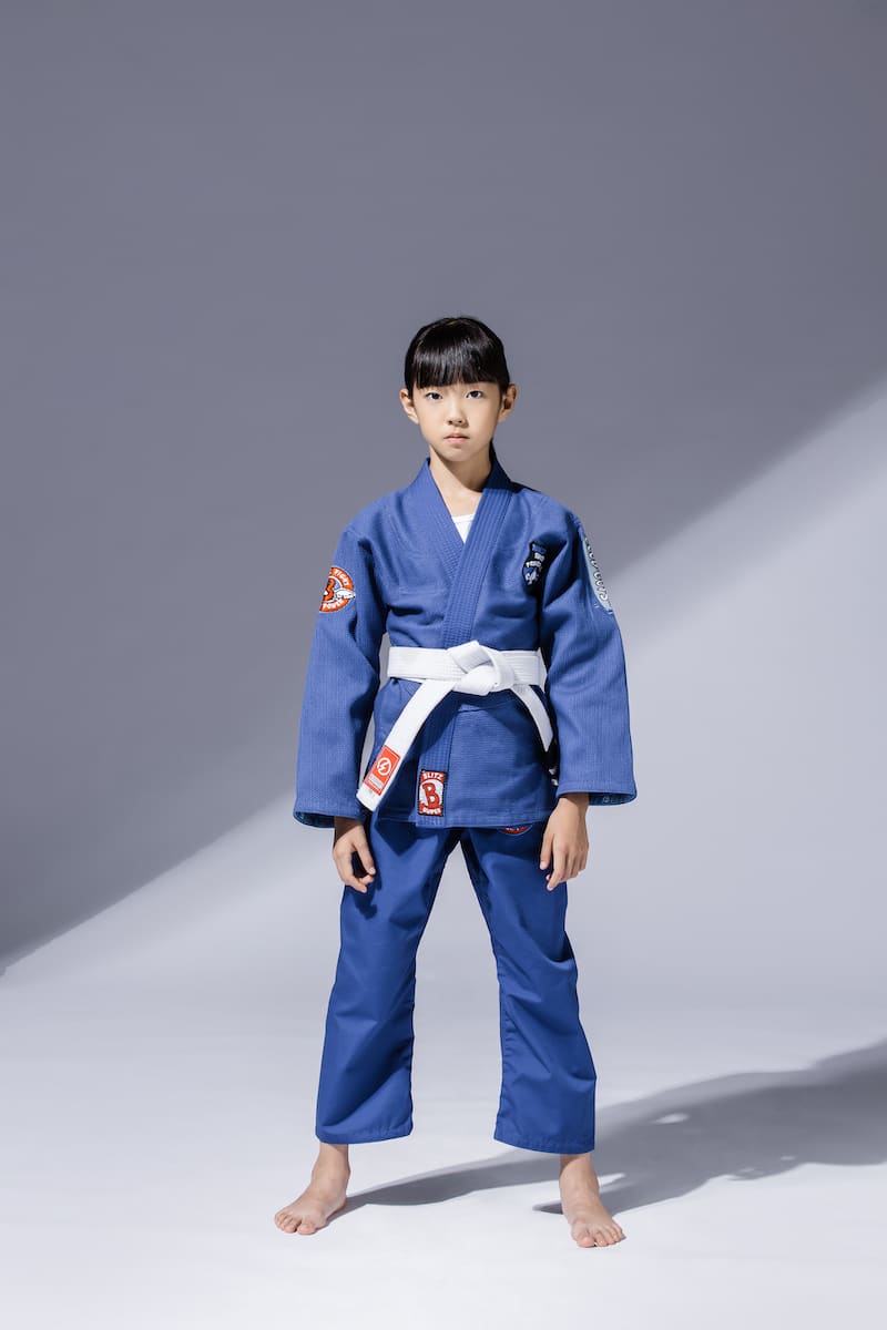 BLITZ Kids Super Power BJJ Gi worn by a young martial artist ready for training, showcasing comfort and durability.