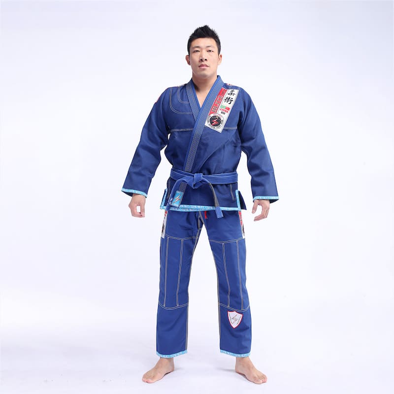 Classic BLITZ BJJ Gi: Embrace Excellence & Tradition worn by a practitioner in blue.
