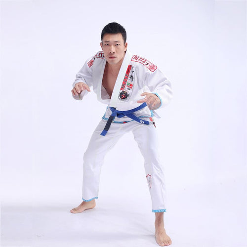 Classic BLITZ BJJ Gi: Embrace Excellence & Tradition worn by a practitioner in a combat stance.