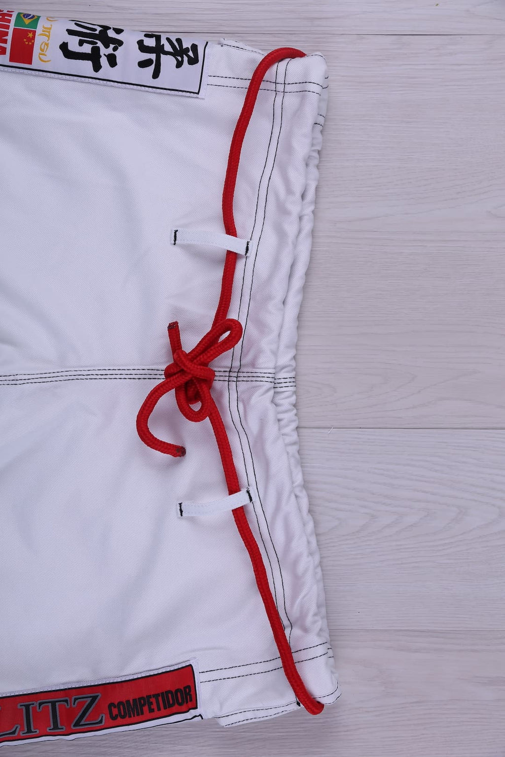 Classic BLITZ BJJ Gi: Embrace Excellence & Tradition featuring detailed embroidery and traditional design.