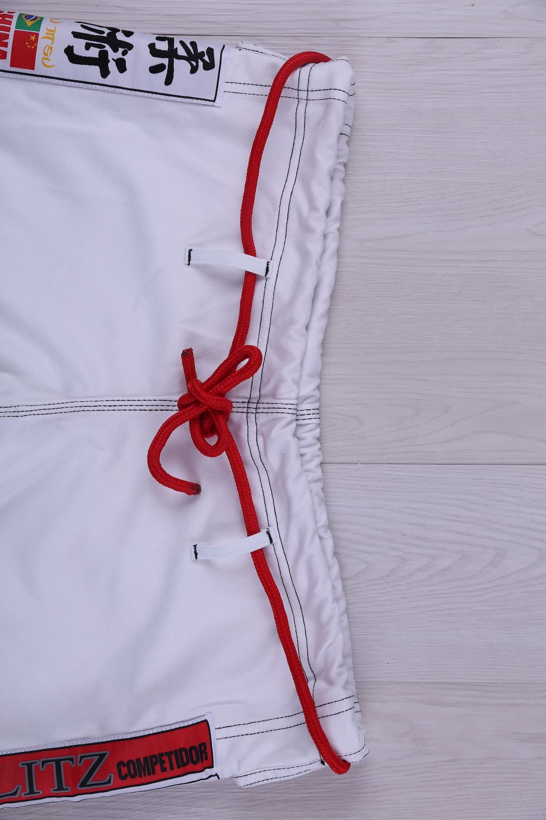 Classic BLITZ BJJ Gi: Embrace Excellence & Tradition featuring detailed embroidery and traditional design.