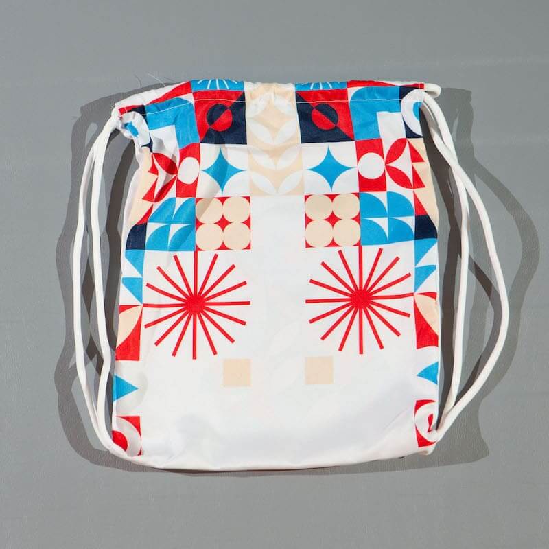 ZHAN Year of the Rabbit BJJ Gi: Embrace the Zodiac Spirit drawstring bag with colorful geometric patterns.
