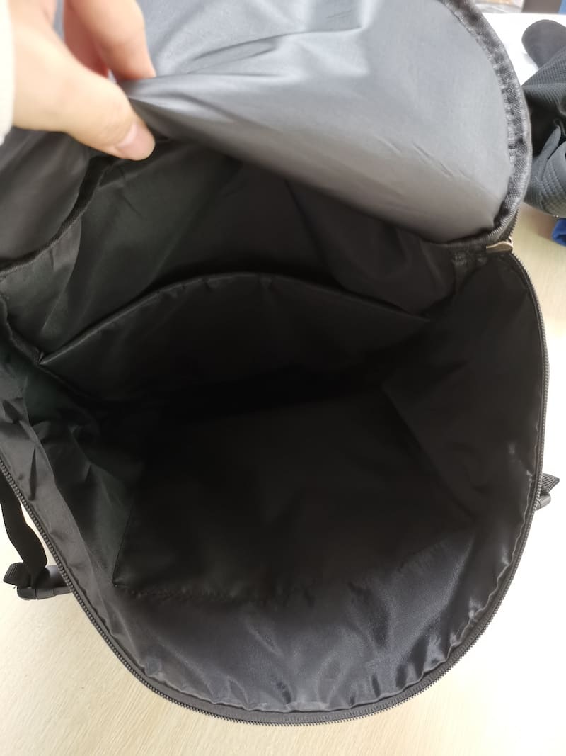 Inside view of the Ultimate BJJ Backpack: Spacious & Durable Gear Bag for Martial Artists, showcasing storage compartments.
