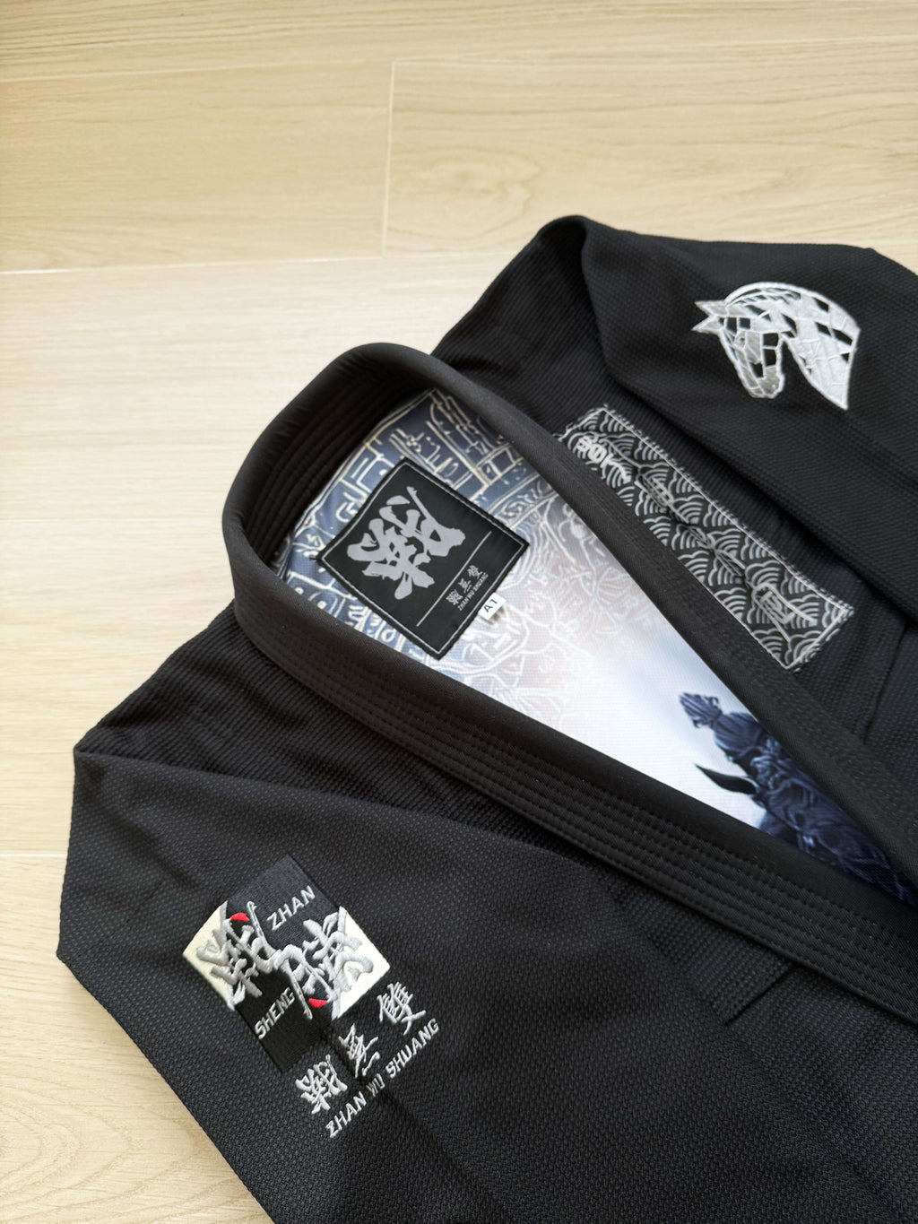 Year of the Horse Limited Edition Bamboo BJJ Gi showcasing a black exterior and intricate horse artwork details.