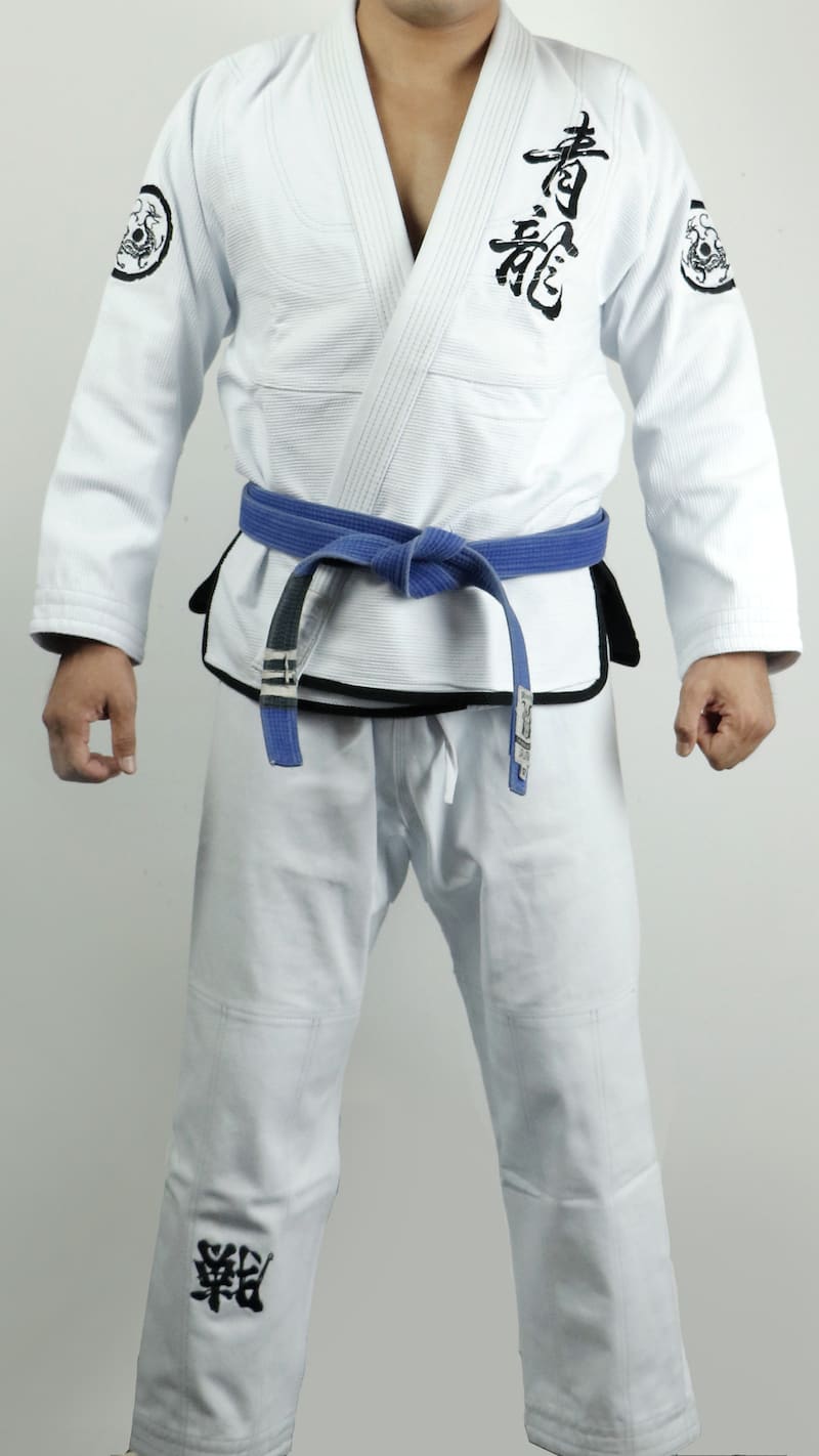 ZHAN Azure Dragon BJJ Gi featuring dragon-themed artwork and a blue belt for martial arts training.