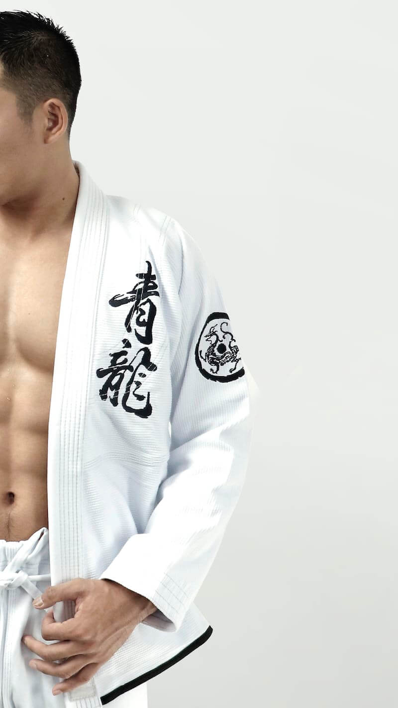 ZHAN Azure Dragon BJJ Gi featuring intricate dragon-themed embroidery and woven labels.