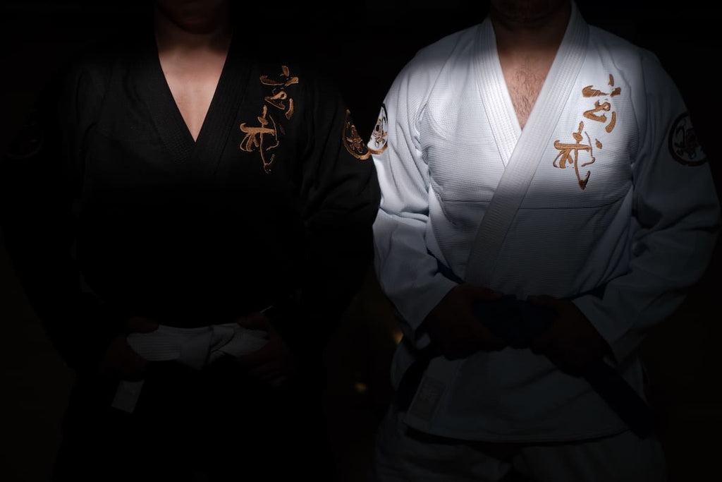 ZHAN Black Tortoise BJJ Gi worn by practitioners in black and white uniforms with intricate embroidery.