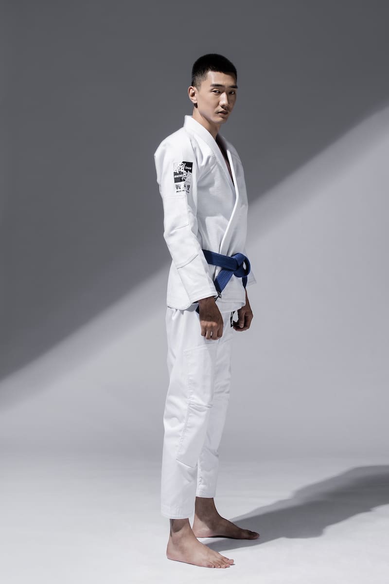 ZHAN Good vs Evil BJJ Gi worn by a practitioner showcasing the contrasting design elements.
