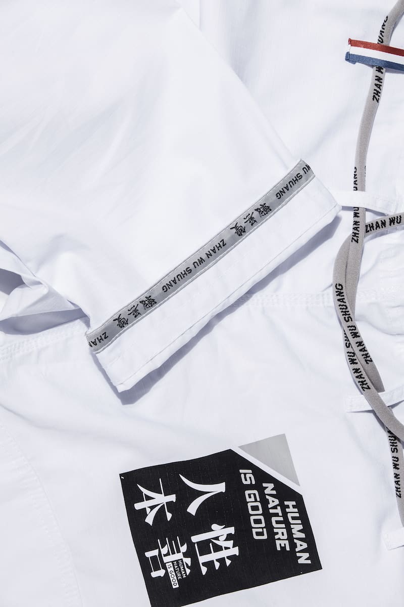 ZHAN Good vs Evil BJJ Gi close-up showcasing design details and logo elements against a white background.