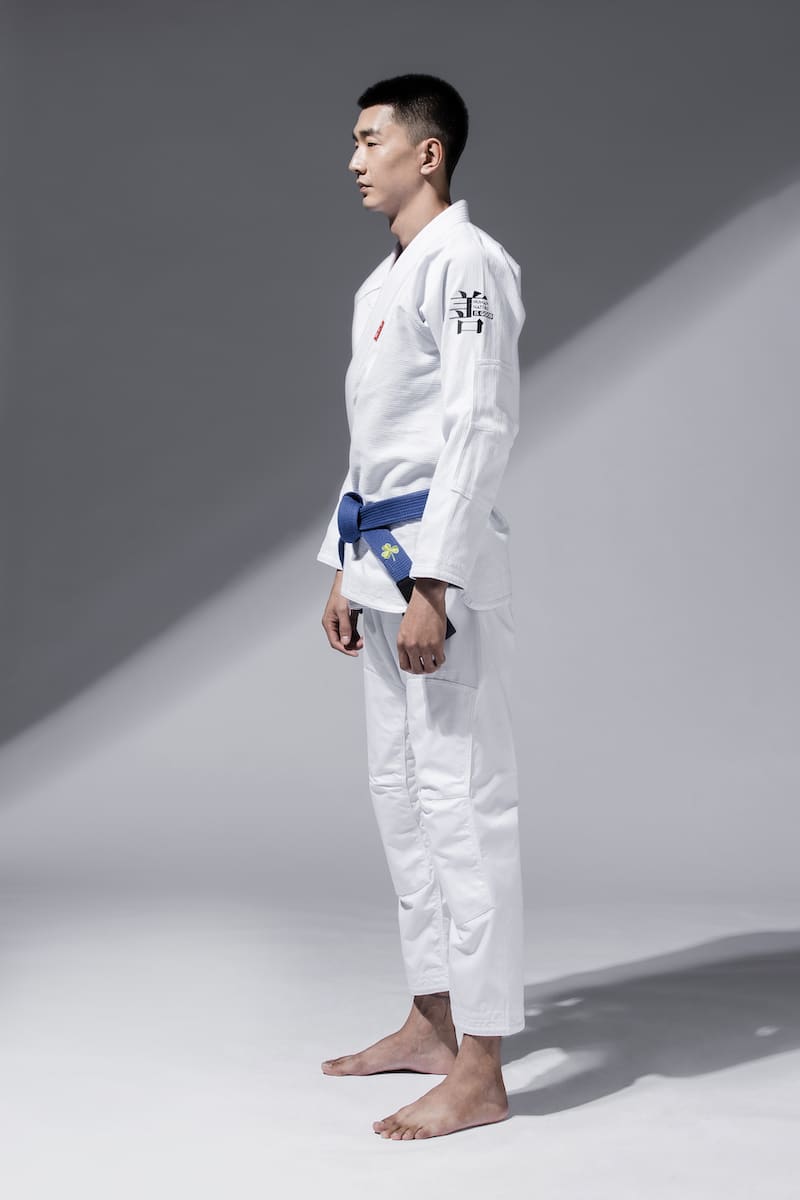 ZHAN Good vs Evil BJJ Gi worn by a practitioner in a side profile.