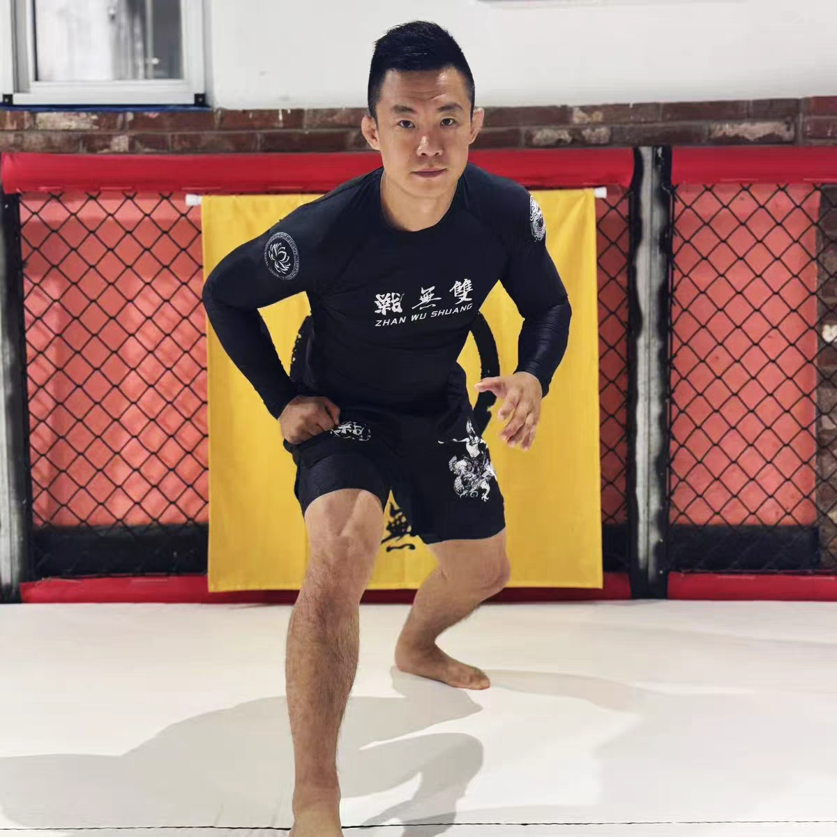 ZHAN Nezha Long Sleeve BJJ Rash Guard & No-Gi Shorts Set worn by a fighter in action during training.