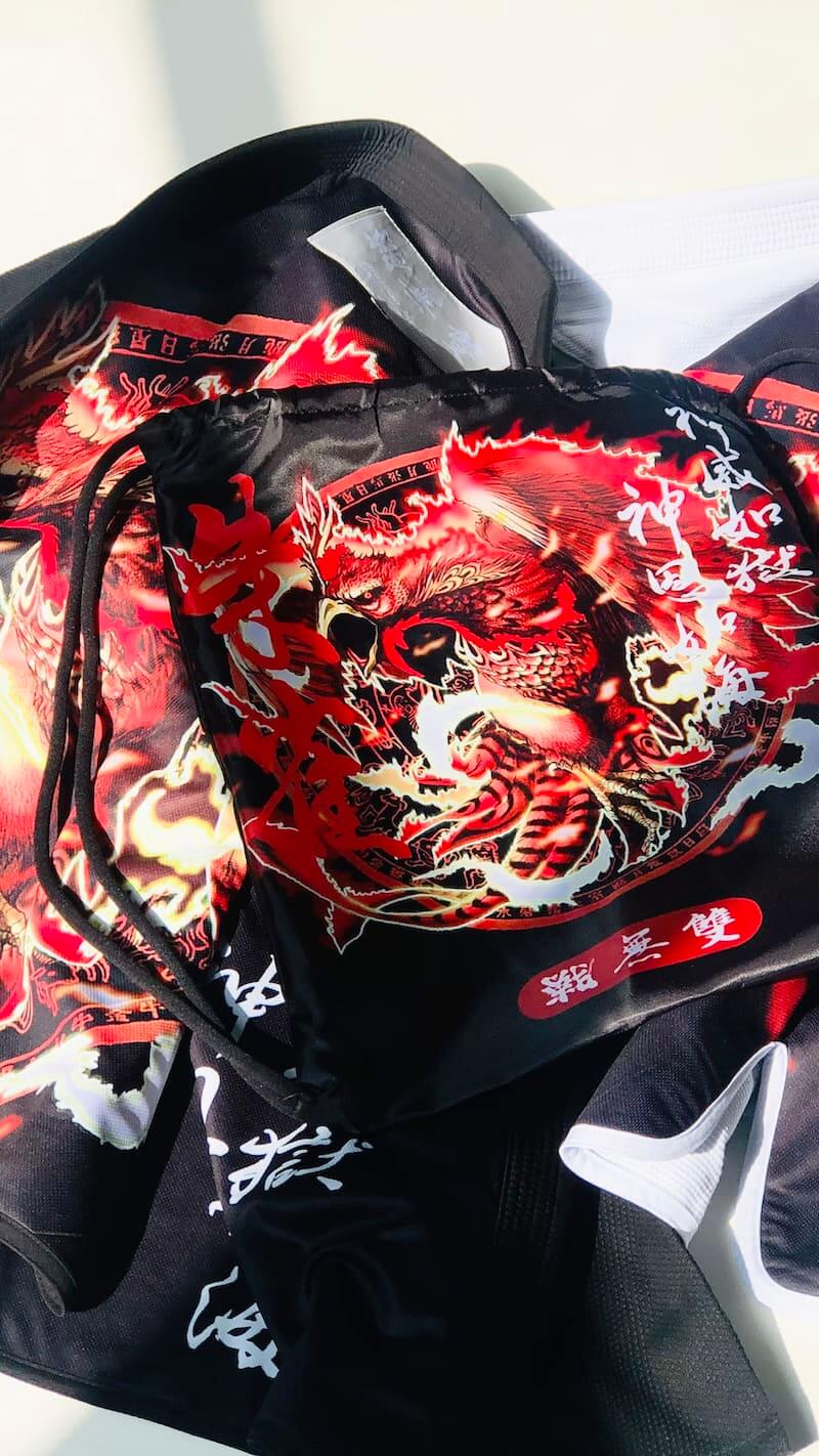 ZHAN Vermilion Phoenix BJJ Gi featuring intricate phoenix artwork and bold colors reflecting Eastern mythology.