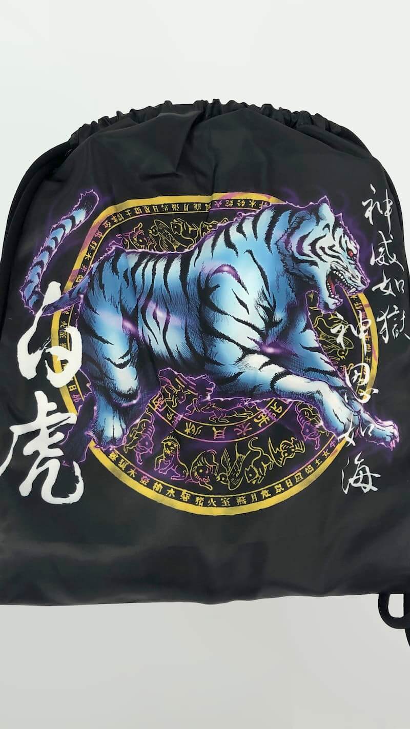 ZHAN White Tiger BJJ Gi design featuring a dynamic tiger illustration and Eastern mythology elements.