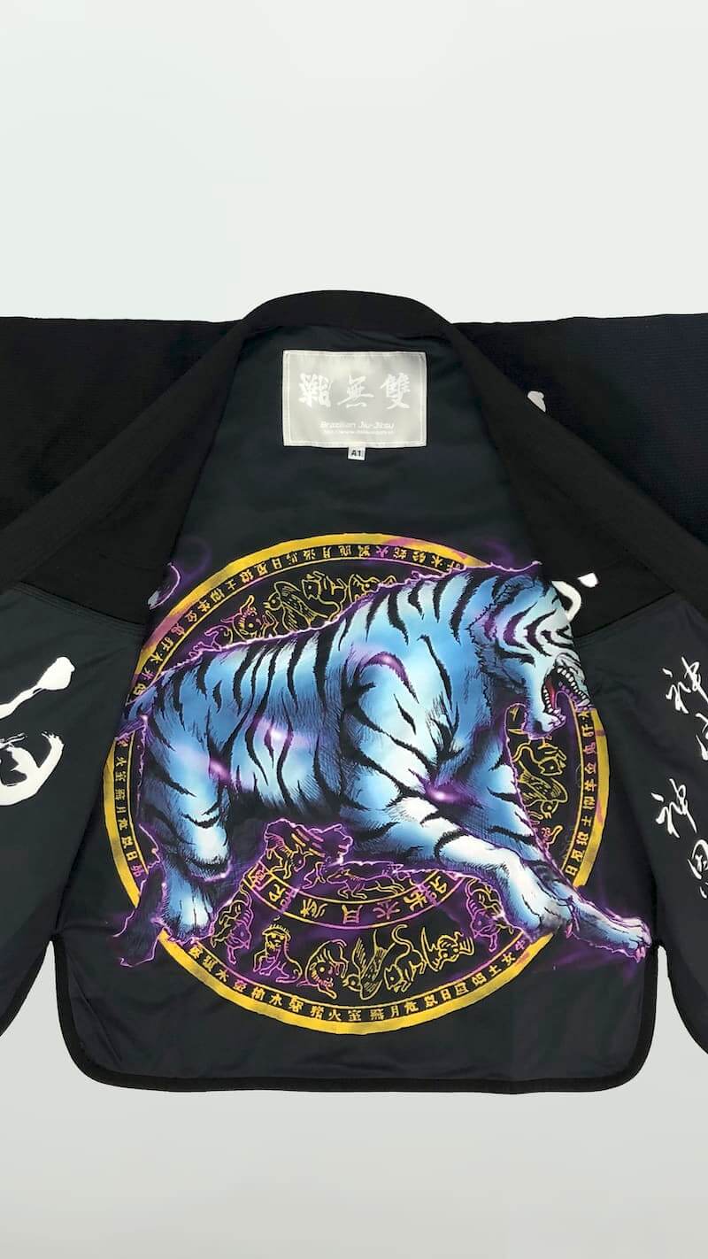 ZHAN White Tiger BJJ Gi featuring intricate blue tiger artwork and bold designs on the inner lining.