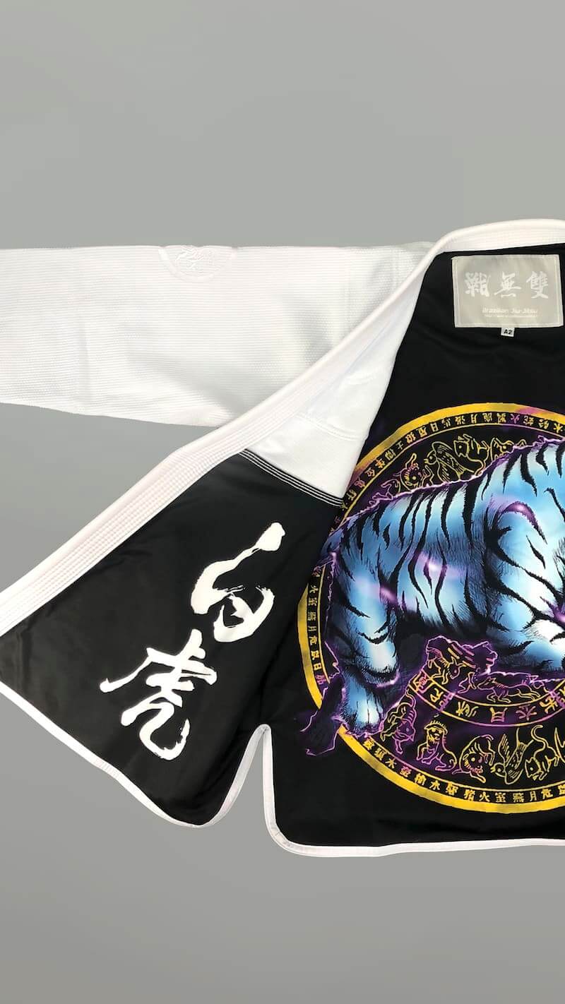 ZHAN White Tiger BJJ Gi featuring tiger-themed artwork and embroidery in black and white design.