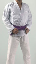 ZHAN White Tiger BJJ Gi worn by a practitioner with a purple belt, showcasing its elegant design and craftsmanship.
