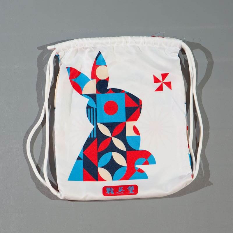 ZHAN Year of the Rabbit BJJ Gi: Embrace the Zodiac Spirit drawstring bag featuring a colorful rabbit design.