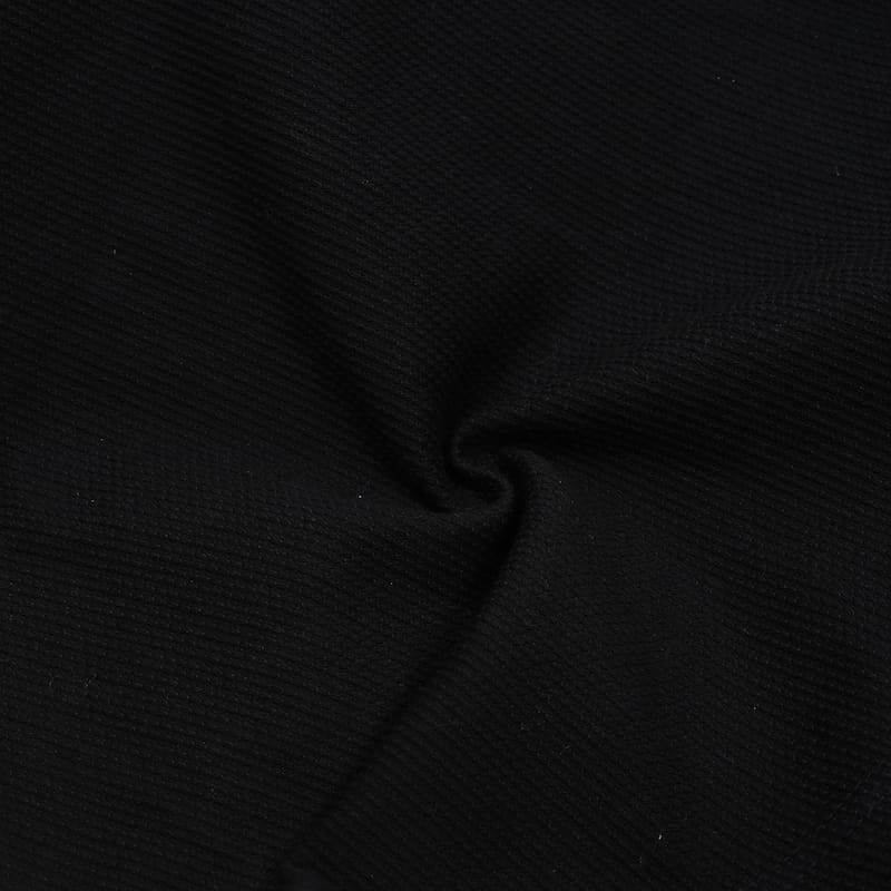 ZHAN Basic Women's BJJ Gi: Embrace Elegance & Performance - Close-up of black fabric texture.